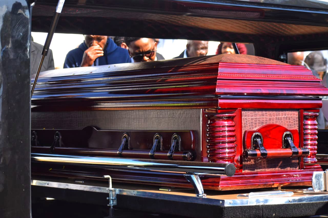 Mahogany casket carried from a Sepotokele hearse